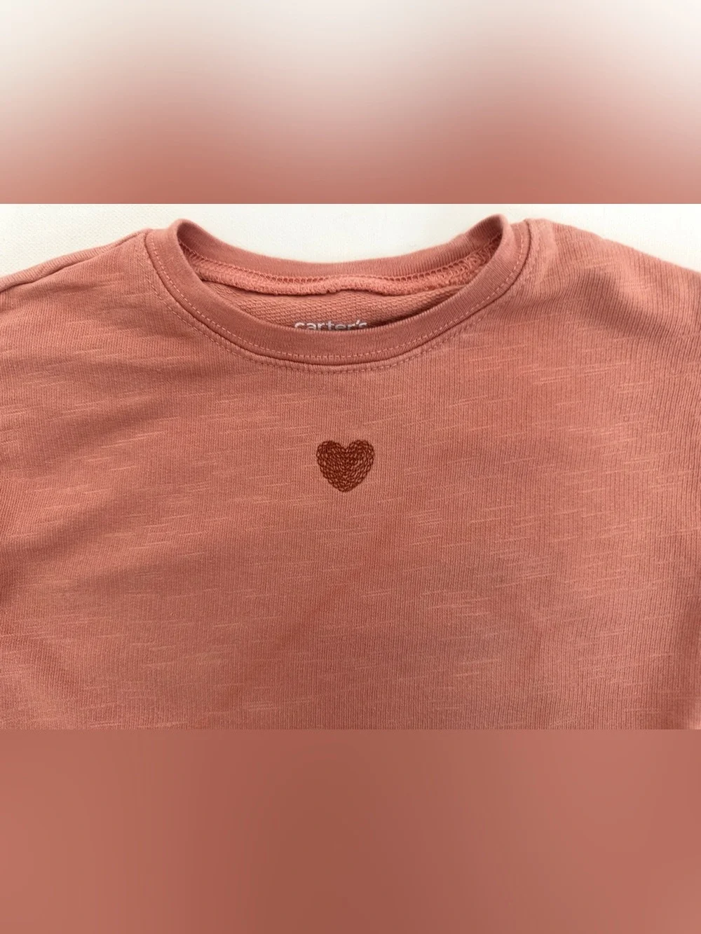 Carter's girl’s sweatshirt, small glittery heart on the chest. Size 18M.